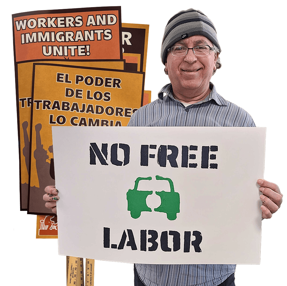 Person holding a "No Free Labor" sign